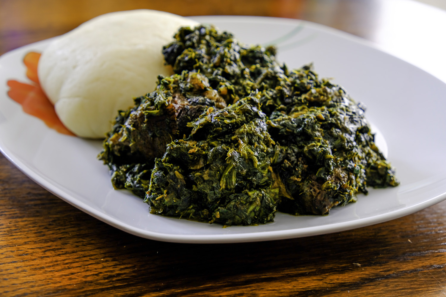 Nigerian Pounded yam served with Afang vegetable Soup West African Food