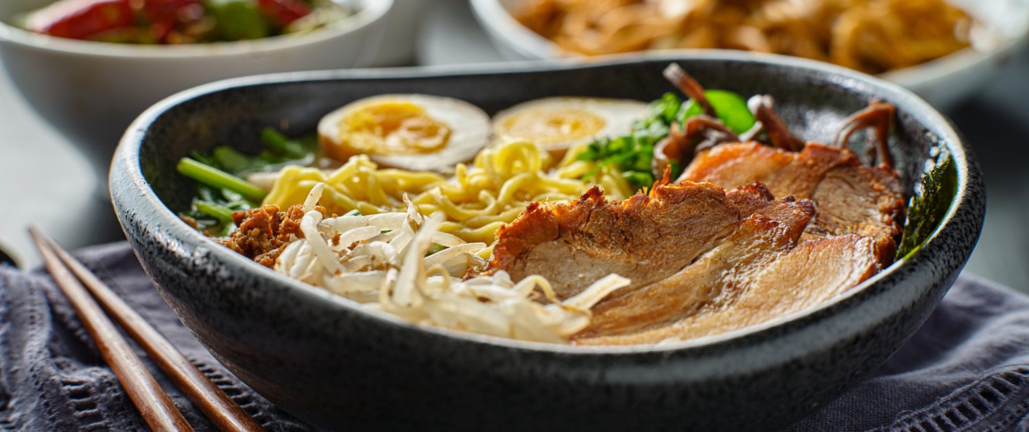 japanese tonkotsu ramen bowl on dinner table at restaurant