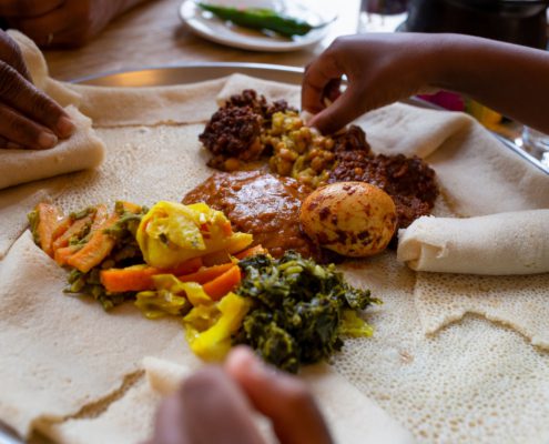 Vegetarian injera meal, with shiro, lentils, egg and a variety of vegetables