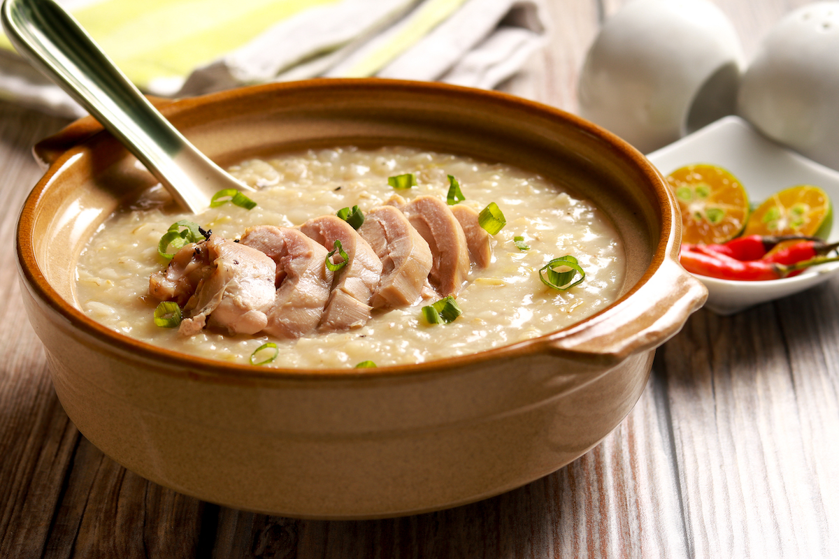 Delicious Chicken Rice Porridge on the table. Filipino cuisine. Arroz caldo. Filipino Food