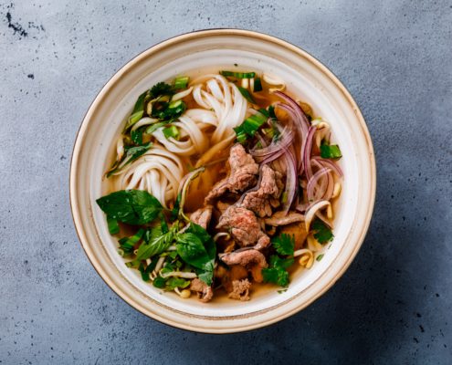 Pho Bo vietnamese Soup with beef in bowl on concrete background on our daily blog Southeast Asian Food Vietnamese Pantry Staples our blog stories