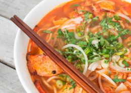 Vegetarian central Vietnamese hot and spicy soup with a pair of chop sticks, Bun Bo Hue chay on our blog stories