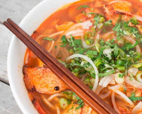 Vegetarian central Vietnamese hot and spicy soup with a pair of chop sticks, Bun Bo Hue chay on our blog stories