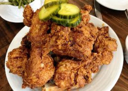 Crispy Deep Fried served in a pile on a plate. A southern U.S. specialty, fried chicken is an iconic local regional food of the United States.