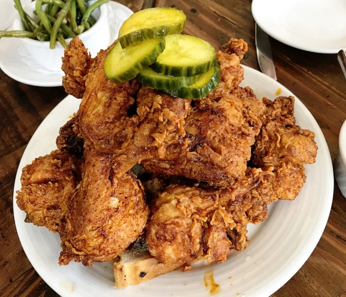 Crispy Deep Fried served in a pile on a plate. A southern U.S. specialty, fried chicken is an iconic local regional food of the United States.